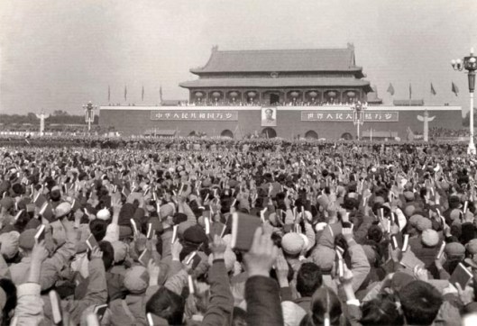 Large communist rally of Red Guards waving Little Red Books of Quotations of Chairman Mao Zedong during Great Proletarian Cultural Revolution, at Tian An Men Square in 1966.
